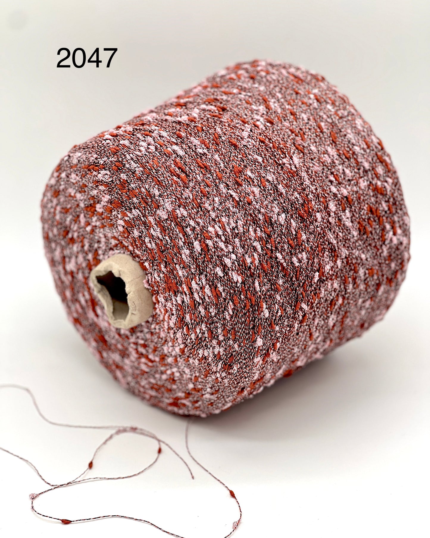 Exclusive iDOKNiT RiGo NODINO lace yarn featuring a radiant 67% viscose and 7% Lurex blend with a decorative Shishibriki texture for sophisticated Italian knitwear.