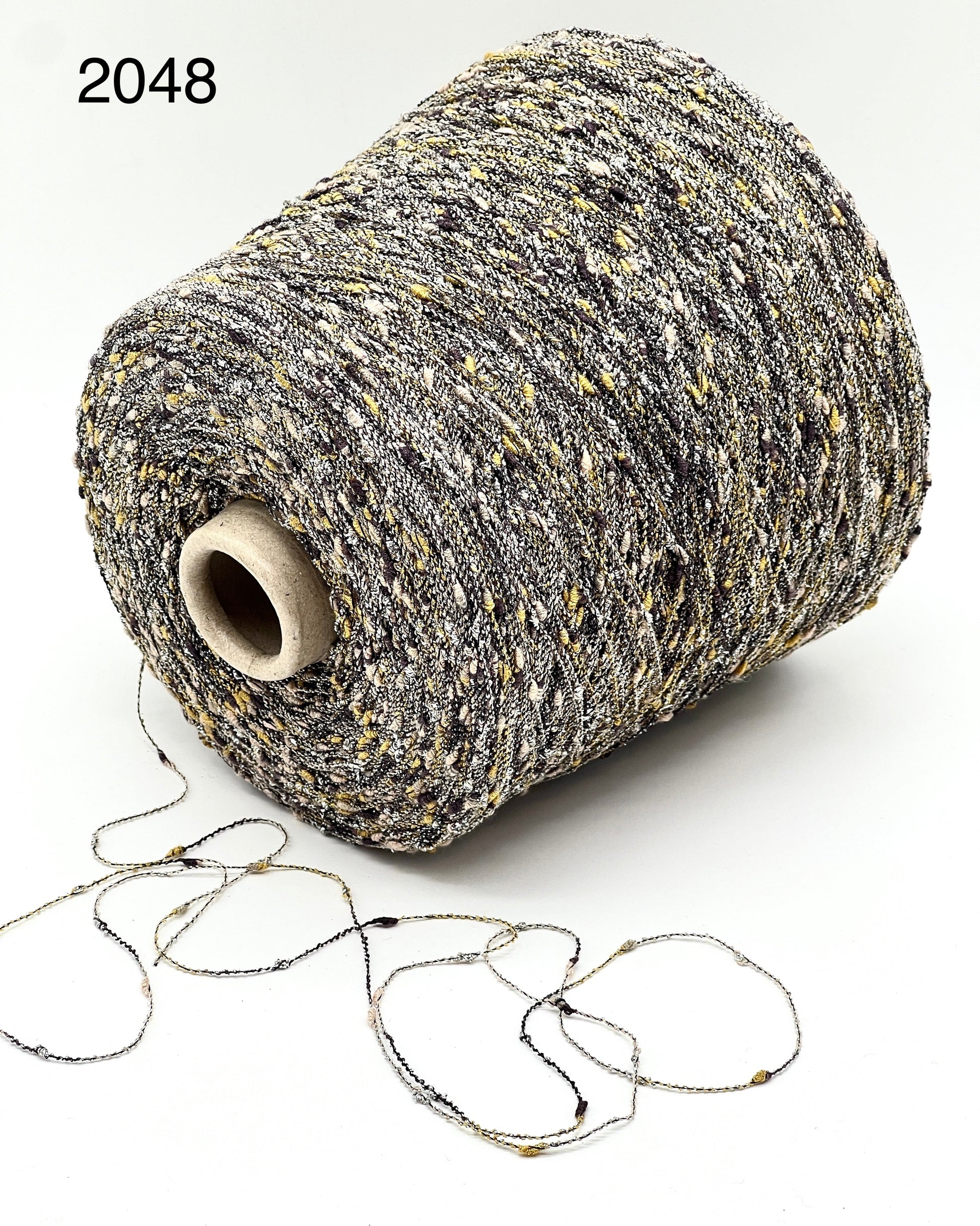 Exclusive iDOKNiT RiGo NODINO lace yarn featuring a radiant 67% viscose and 7% Lurex blend with a decorative Shishibriki texture for sophisticated Italian knitwear.