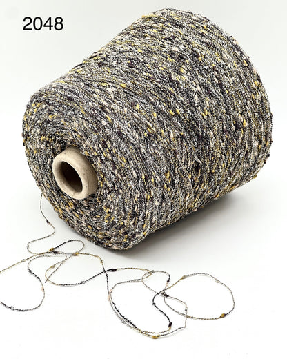 Exclusive iDOKNiT RiGo NODINO lace yarn featuring a radiant 67% viscose and 7% Lurex blend with a decorative Shishibriki texture for sophisticated Italian knitwear.