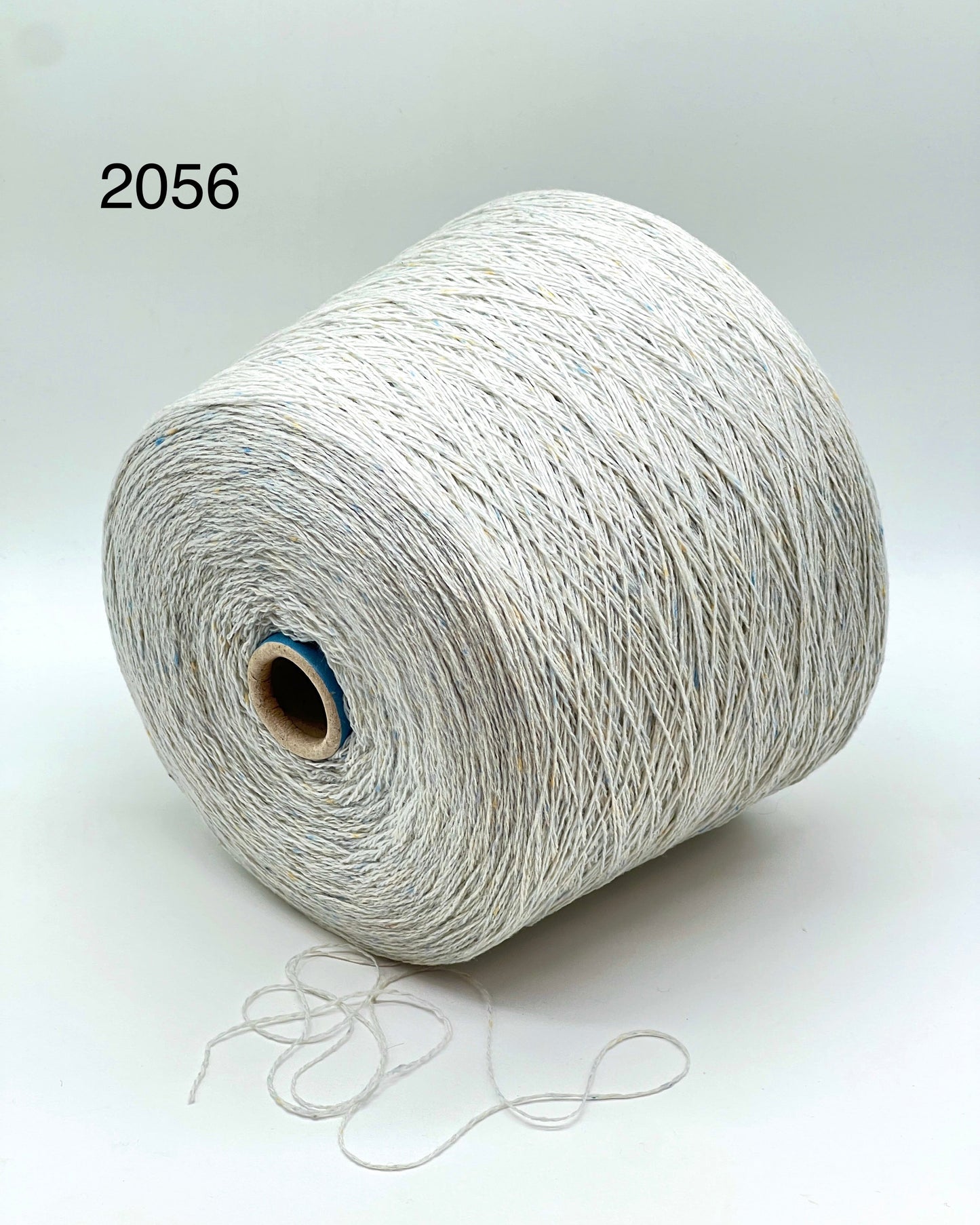 Elegant iDOKNiT SESIA SCOTLAND 100% Extrafine Merino Tweed lace yarn in Nm 2/14, showcasing a sophisticated rustic speckled texture and premium Italian wool quality.