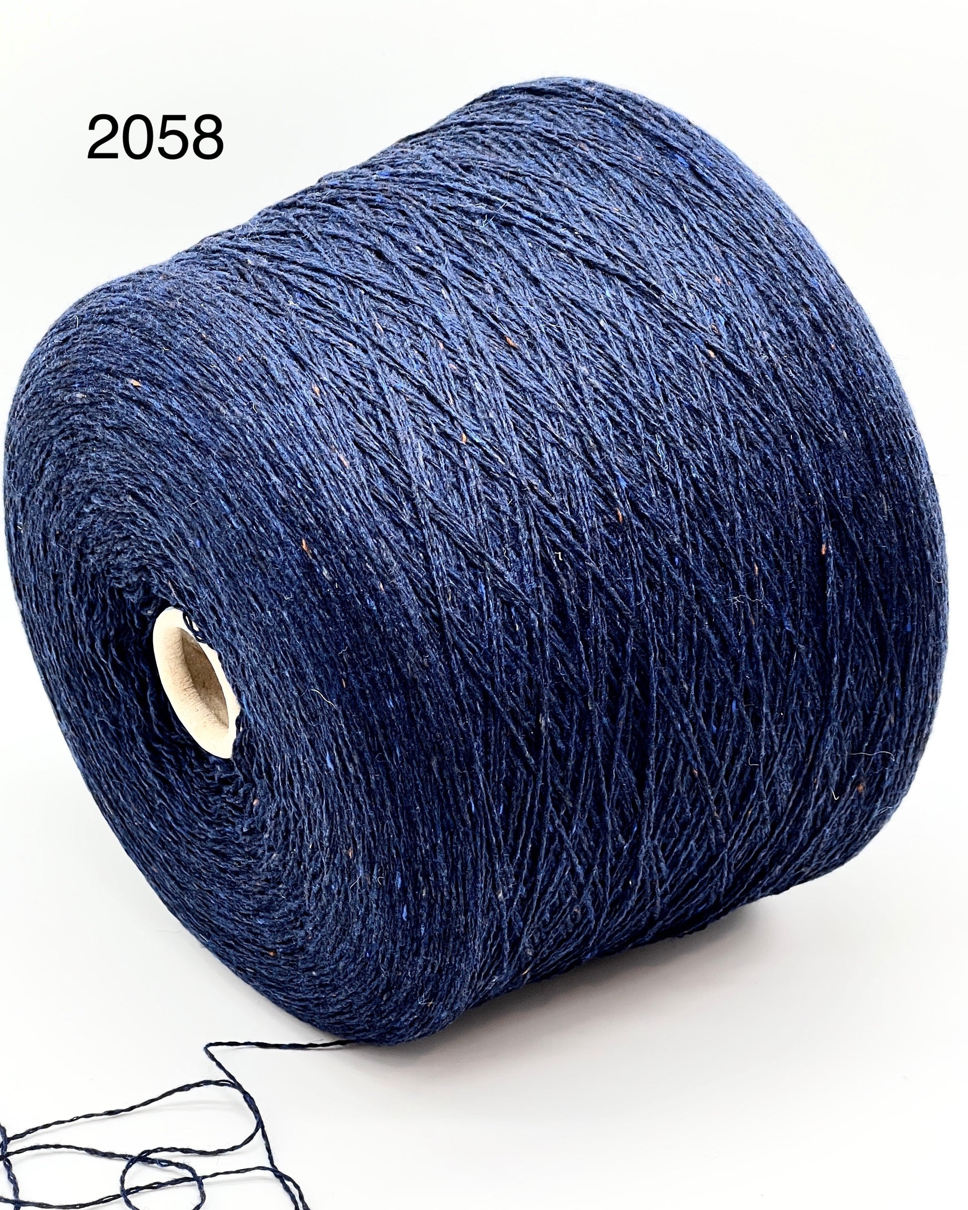 Elegant iDOKNiT SESIA SCOTLAND 100% Extrafine Merino Tweed lace yarn in Nm 2/14, showcasing a sophisticated rustic speckled texture and premium Italian wool quality.