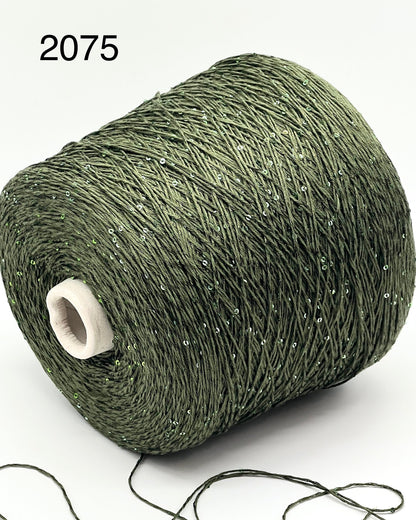 Professional grade RiGo STELLATO sport weight yarn from iDOKNiT, featuring a sophisticated 60% Italian cotton base with 2mm integrated paillettes. This authentic Italian-made yarn is curated by iDOKNiT to provide a refined shimmer and luxury finish for elegant, high-performance knitting projects.