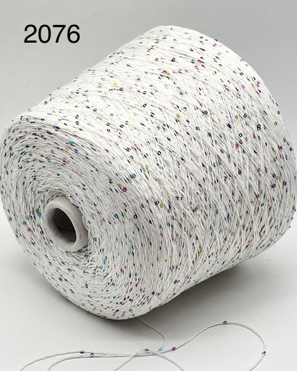 Professional grade RiGo STELLATO sport weight yarn from iDOKNiT, featuring a sophisticated 60% Italian cotton base with 2mm integrated paillettes. This authentic Italian-made yarn is curated by iDOKNiT to provide a refined shimmer and luxury finish for elegant, high-performance knitting projects.