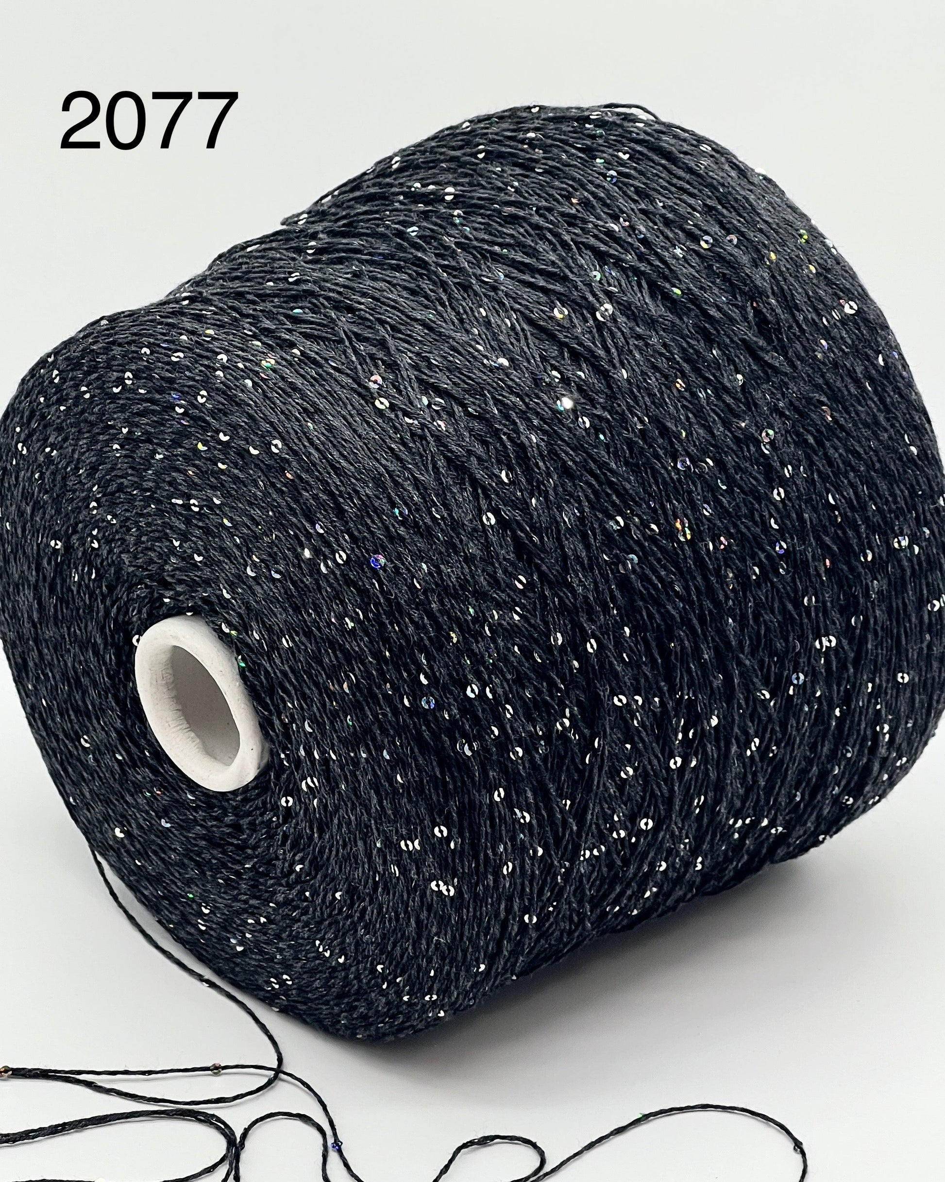 Professional grade RiGo STELLATO sport weight yarn from iDOKNiT, featuring a sophisticated 60% Italian cotton base with 2mm integrated paillettes. This authentic Italian-made yarn is curated by iDOKNiT to provide a refined shimmer and luxury finish for elegant, high-performance knitting projects.