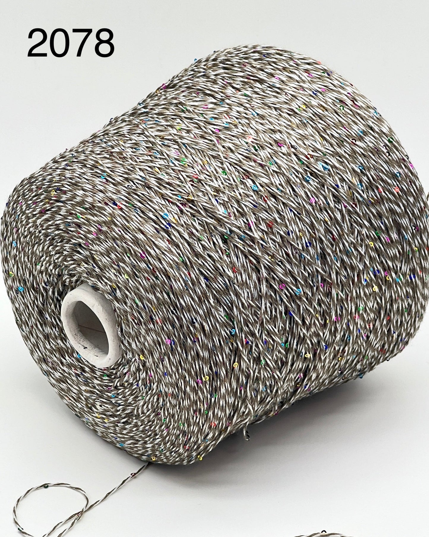 Professional grade RiGo STELLATO sport weight yarn from iDOKNiT, featuring a sophisticated 60% Italian cotton base with 2mm integrated paillettes. This authentic Italian-made yarn is curated by iDOKNiT to provide a refined shimmer and luxury finish for elegant, high-performance knitting projects.