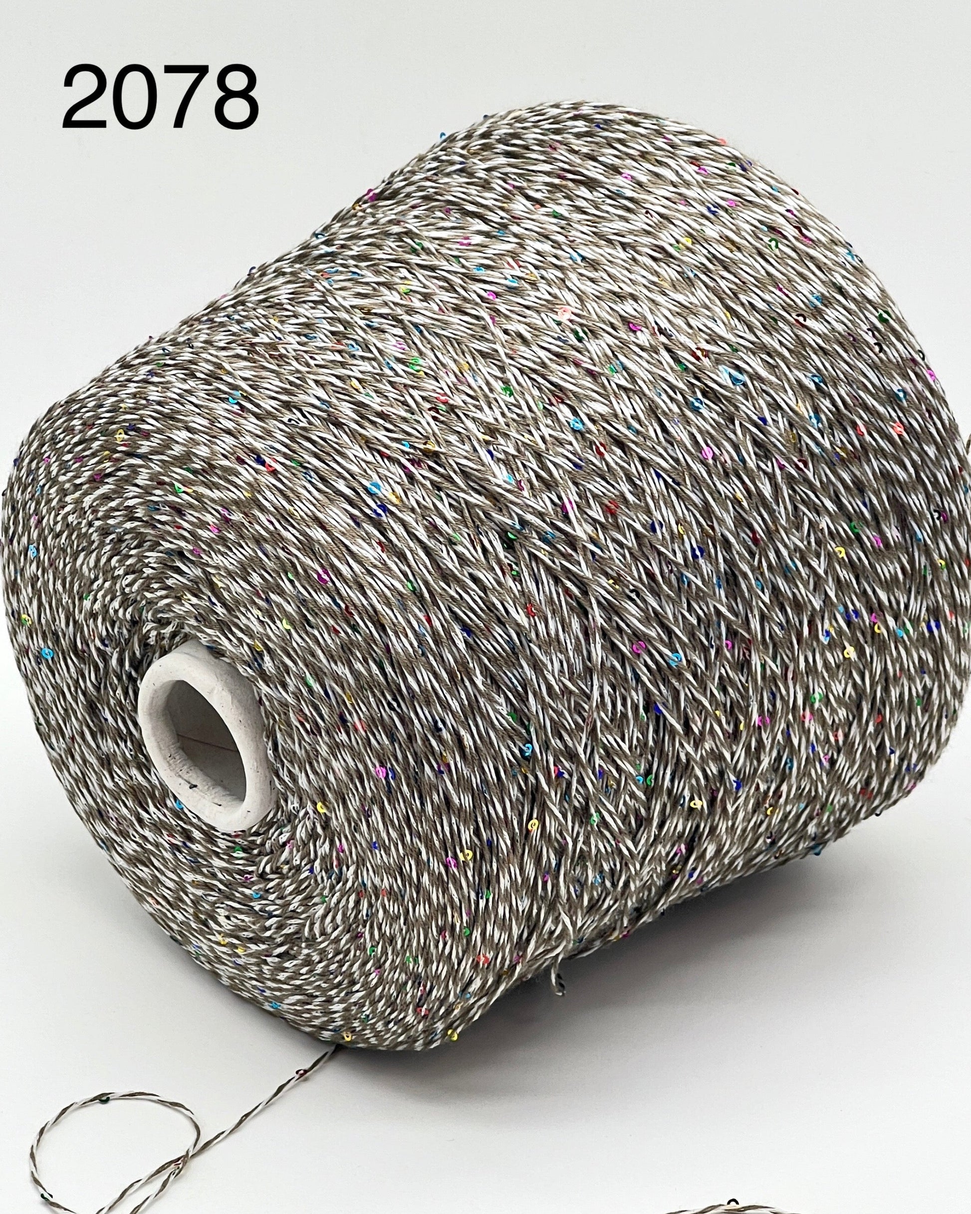 Professional grade RiGo STELLATO sport weight yarn from iDOKNiT, featuring a sophisticated 60% Italian cotton base with 2mm integrated paillettes. This authentic Italian-made yarn is curated by iDOKNiT to provide a refined shimmer and luxury finish for elegant, high-performance knitting projects.