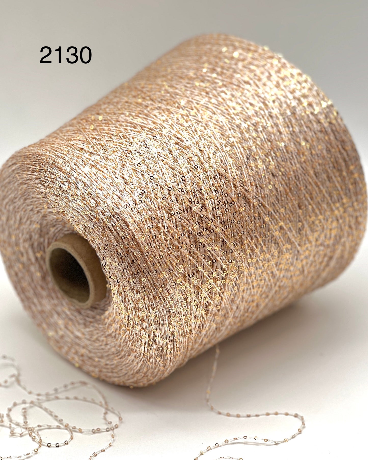 Elite iDOKNiT decorative lace weight yarn, SEQUINS by Cofil Italy. 100% polyester with micro-sequins, 460m/100g. Authentic Italian-made sparkling carry-along yarn curated by iDOKNiT to add texture and shine to professional knitting projects.
