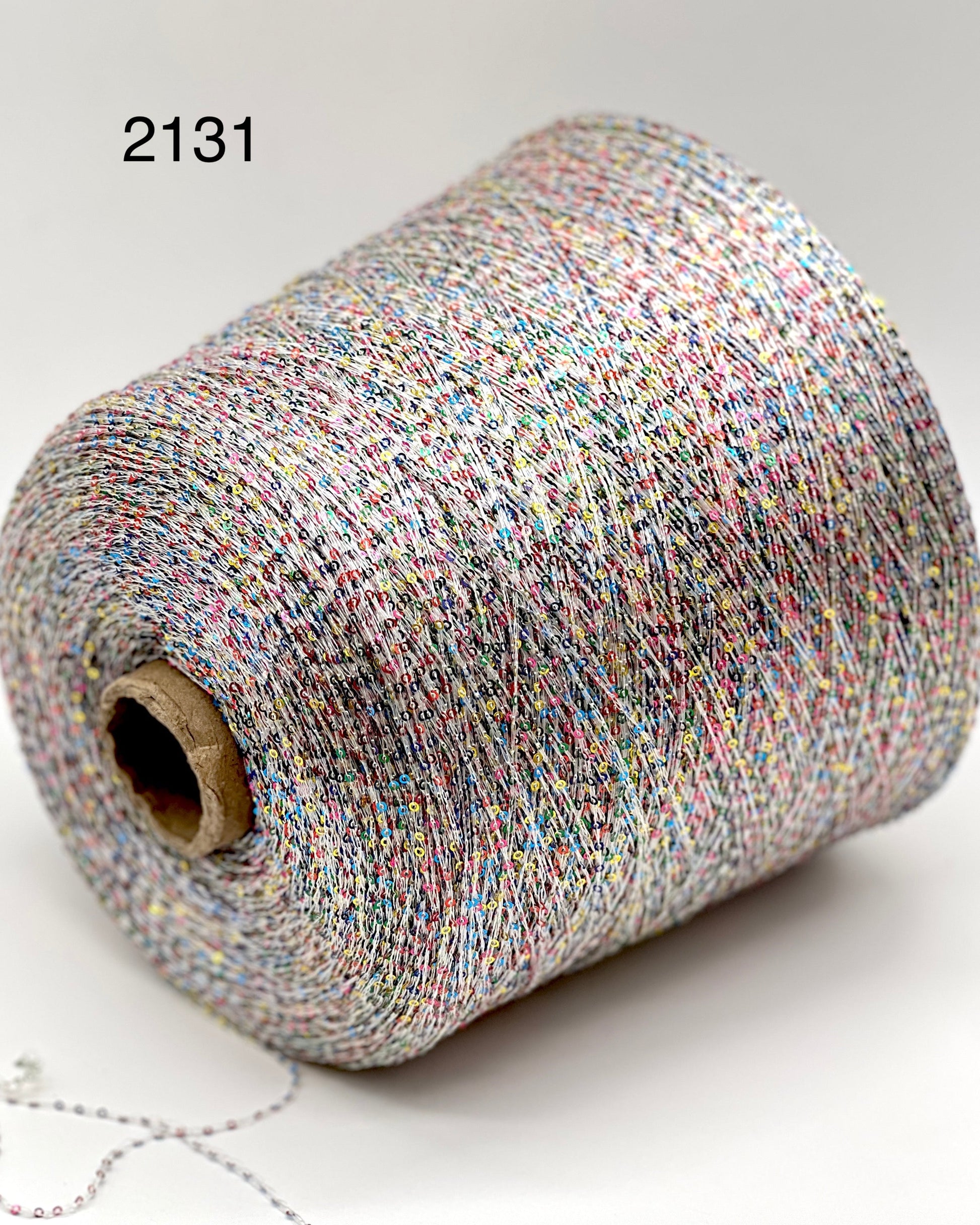 Elite iDOKNiT decorative lace weight yarn, SEQUINS by Cofil Italy. 100% polyester with micro-sequins, 460m/100g. Authentic Italian-made sparkling carry-along yarn curated by iDOKNiT to add texture and shine to professional knitting projects.
