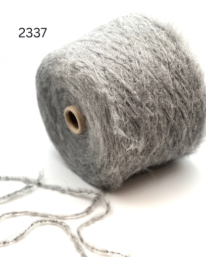 Luxury alpaca merino puffy yarn BUBBLE by Lineapiu Italia
Soft airy Italian DK yarn with alpaca halo and cloud texture
Lineapiu Italia BUBBLE yarn close up showing fluffy structure
Italian lightweight fashion yarn for sweaters and cardigans
Puffy alpaca merino yarn with modern luxury texture