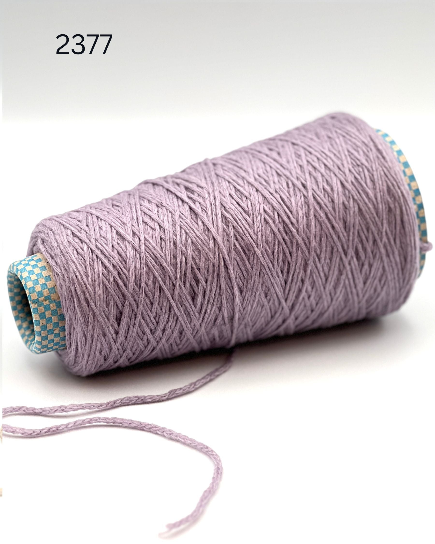 Rare CARIAGGI PIUMA 100% cashmere chainette yarn on original mill cone with original label and lofty cashmere texture.