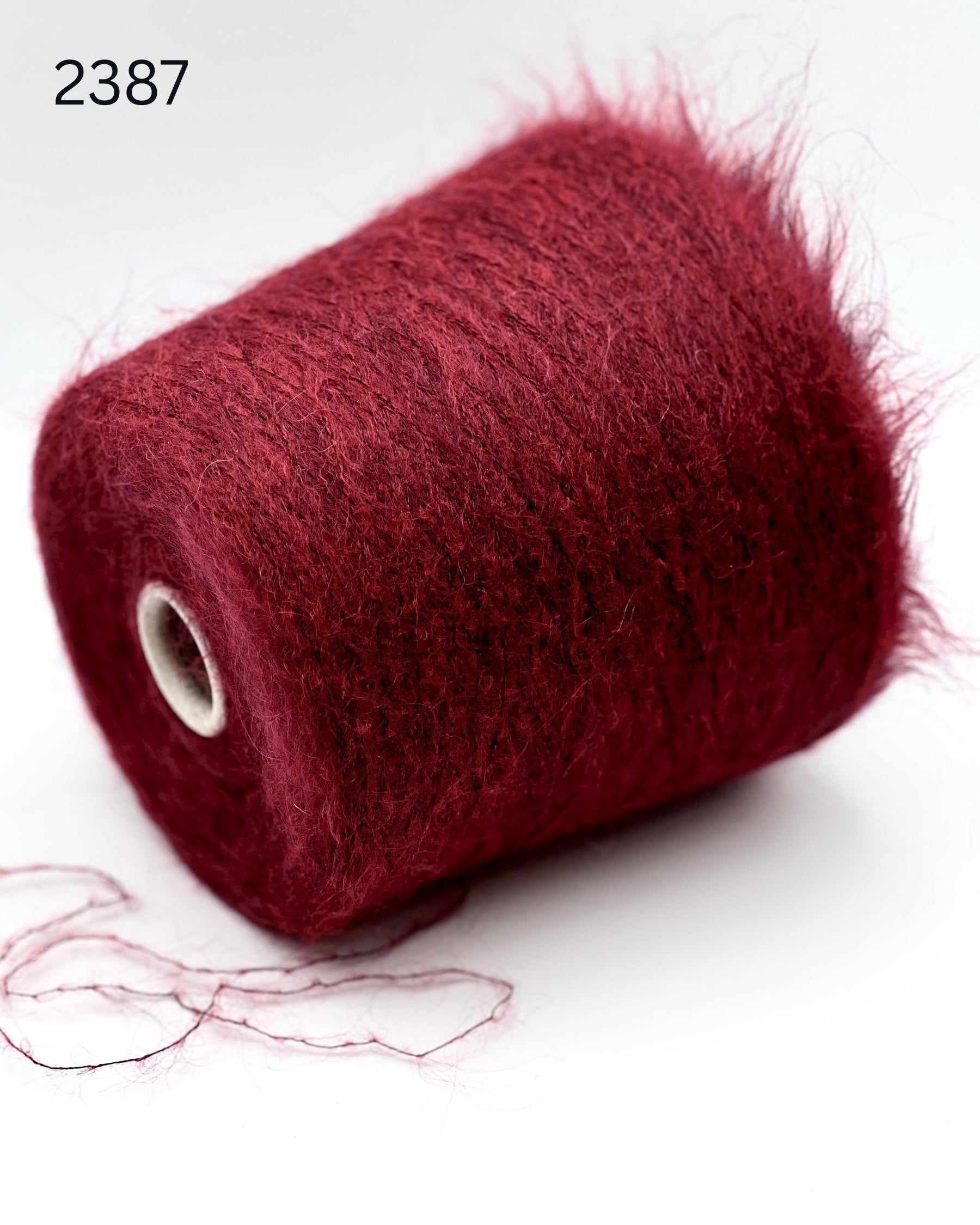 Exclusive iDOKNiT extra fine lace weight yarn, ASTRO by IGEA Italy. A luxury cloud-like blend of 67% superkid mohair, 30% polyamide, and 3% extra fine merino wool providing 1000m per 100g. Authentic Italian-made premium fiber curated by iDOKNiT for airy, delicate lace knitting, lightweight garments, and elegant multi-strand fiber blending.