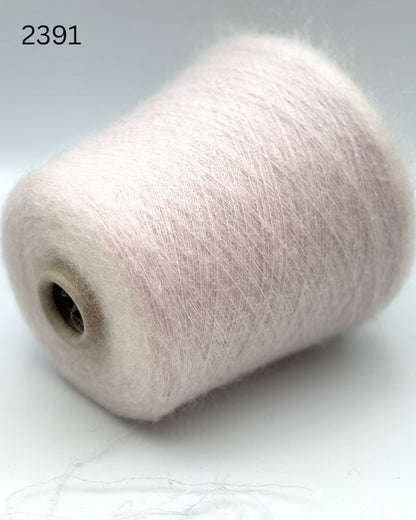 Exclusive iDOKNiT extra fine lace weight yarn, ASTRO by IGEA Italy. A luxury cloud-like blend of 67% superkid mohair, 30% polyamide, and 3% extra fine merino wool providing 1000m per 100g. Authentic Italian-made premium fiber curated by iDOKNiT for airy, delicate lace knitting, lightweight garments, and elegant multi-strand fiber blending.