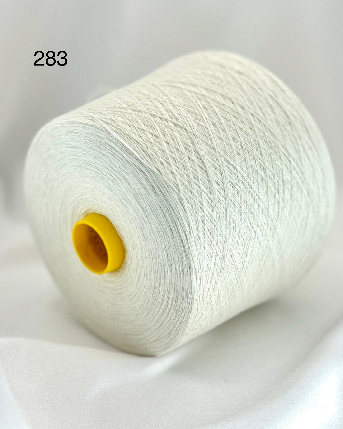 Exquisite iDOKNiT Todd & Duncan ODYSSEY yarn, 50% Cashmere and 50% Cotton blend in Nm 2/36 lace weight, highlighting the premium Scottish texture and soft matte finish for luxury summer knits.