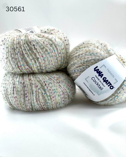 Lana Gatto COCKTAIL paillettes yarn soft sparkle Italian sport yarn
Luxury Italian sport yarn COCKTAIL with mohair halo and sequins
Close up of COCKTAIL yarn showing micro paillettes and texture
Soft sparkle yarn COCKTAIL for sweaters shawls and accessories
Italian fashion yarn with paillettes for festive knitwear