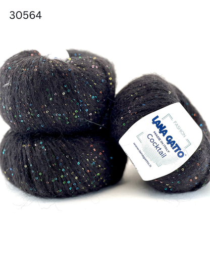 Lana Gatto COCKTAIL paillettes yarn soft sparkle Italian sport yarn
Luxury Italian sport yarn COCKTAIL with mohair halo and sequins
Close up of COCKTAIL yarn showing micro paillettes and texture
Soft sparkle yarn COCKTAIL for sweaters shawls and accessories
Italian fashion yarn with paillettes for festive knitwear