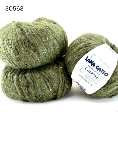 Lana Gatto COCKTAIL paillettes yarn soft sparkle Italian sport yarn
Luxury Italian sport yarn COCKTAIL with mohair halo and sequins
Close up of COCKTAIL yarn showing micro paillettes and texture
Soft sparkle yarn COCKTAIL for sweaters shawls and accessories
Italian fashion yarn with paillettes for festive knitwear