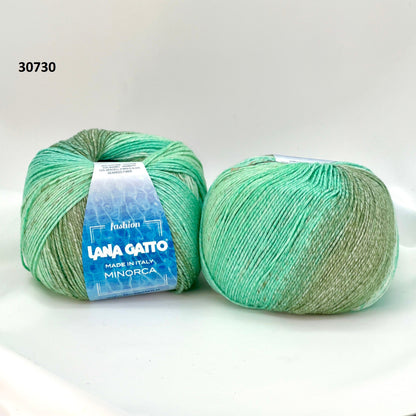 Luxury Italian designer yarn collection for iDOKNiT, featuring premium natural fibers on cones for professional hand-knit and machine-knitting projects.