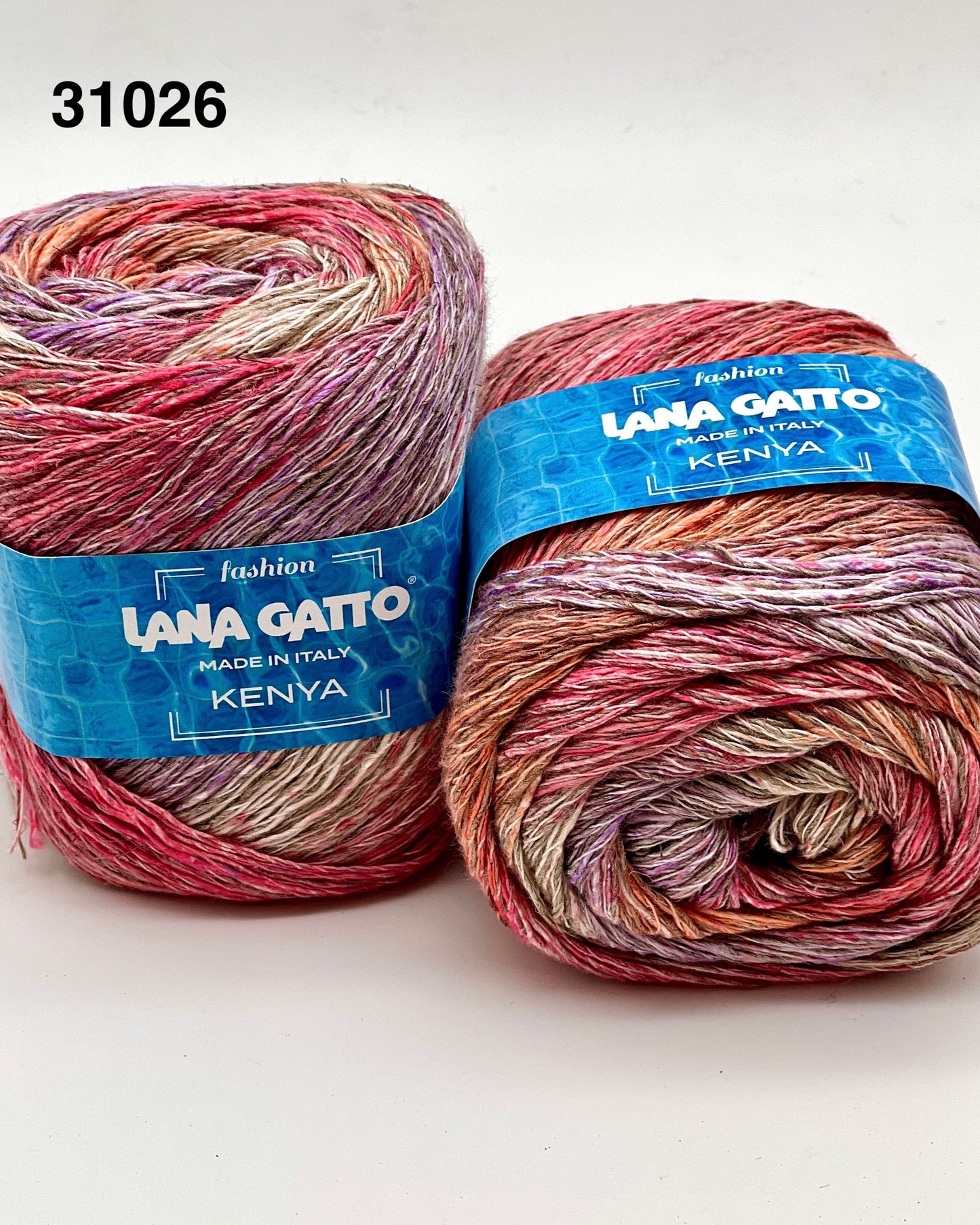 Two skeins of multicolored yarn with 'Lana Gatto' labels on a white background