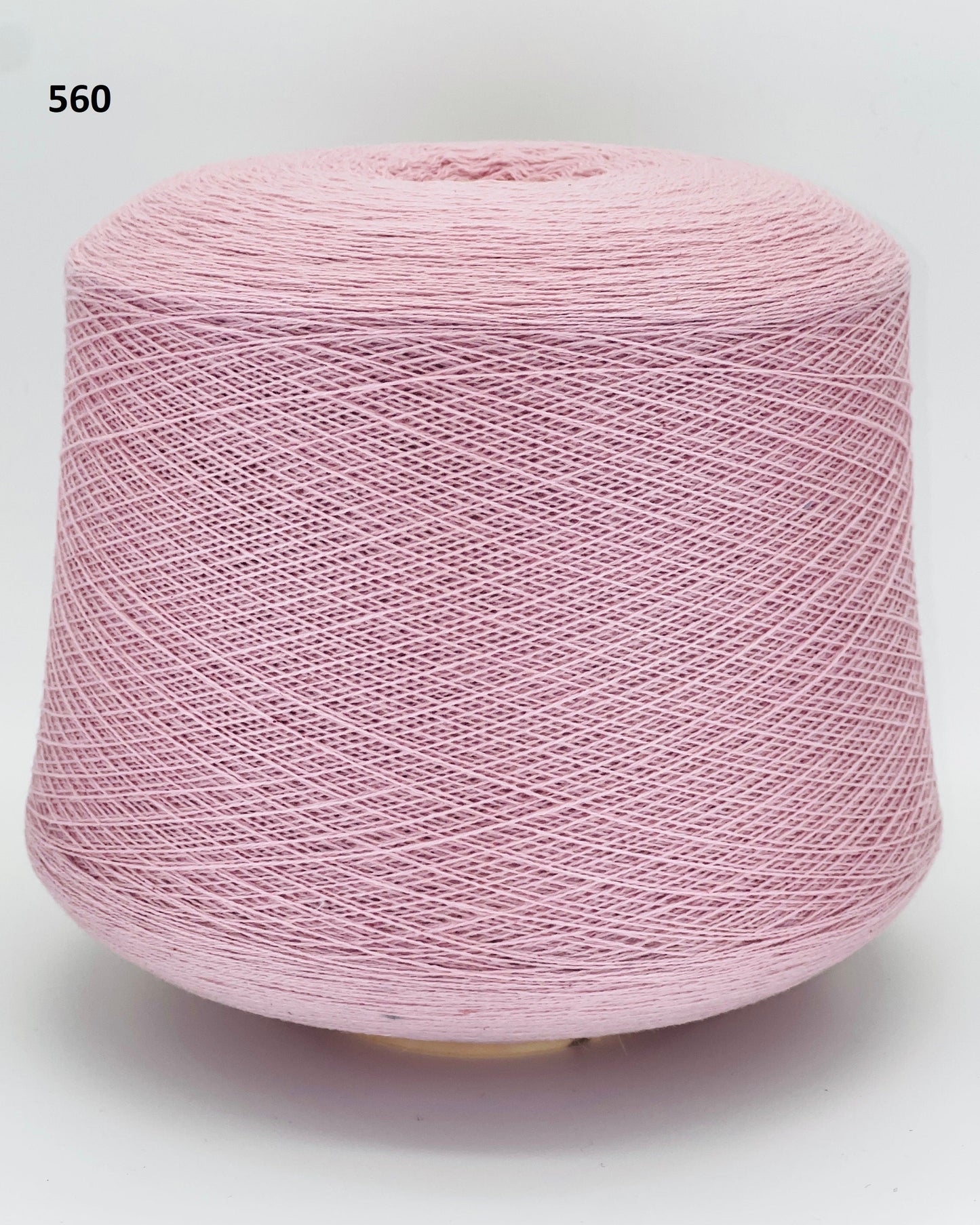 Todd & Duncan 100% Cashmere yarn (2/28 Nm) in a soft neutral palette. Shown as high-quality 2-ply lace weight thread on cones. Made in Scotland. Premium luxury yarn for retail at iDOKNiT.com.