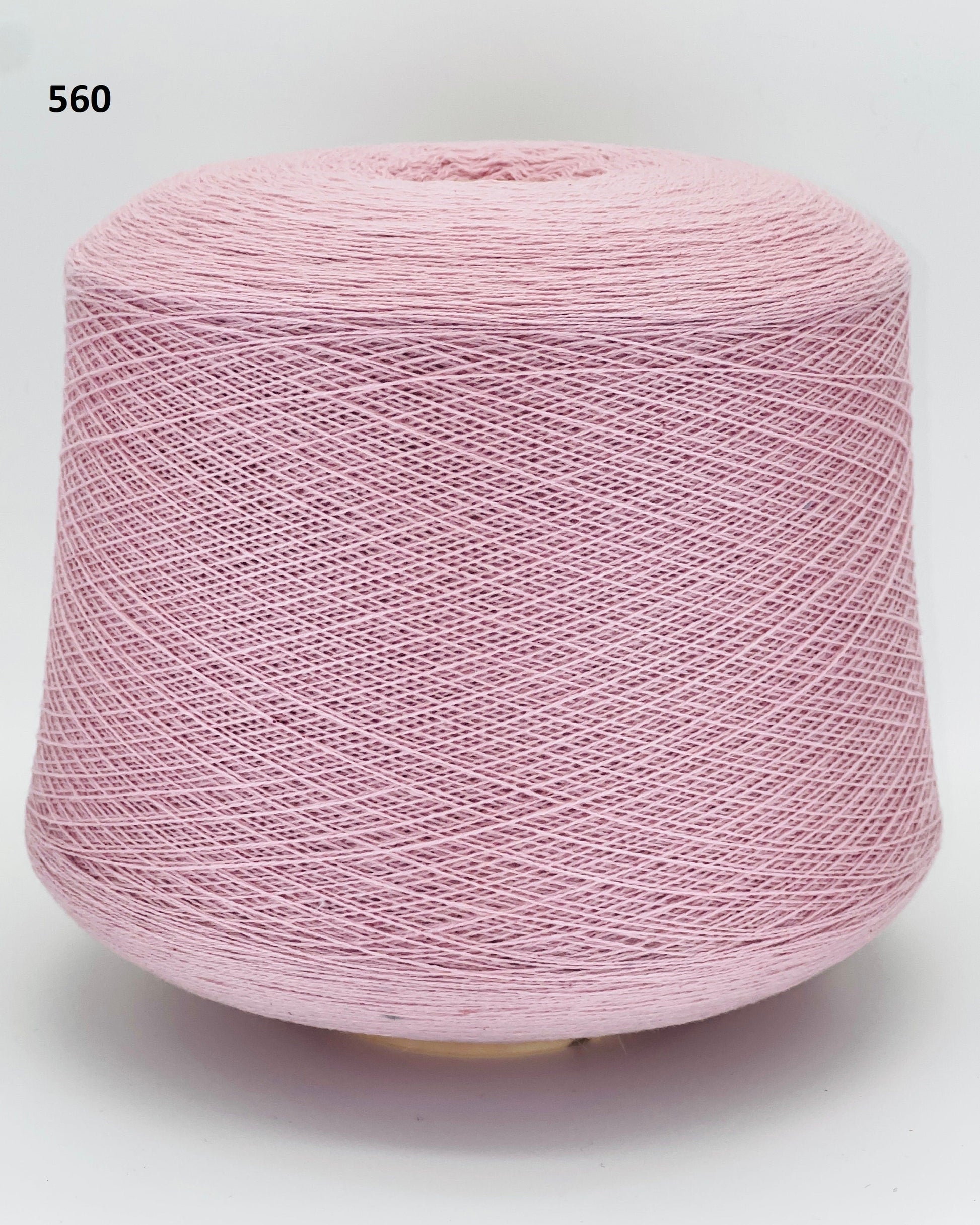 Todd & Duncan 100% Cashmere yarn (2/28 Nm) in a soft neutral palette. Shown as high-quality 2-ply lace weight thread on cones. Made in Scotland. Premium luxury yarn for retail at iDOKNiT.com.