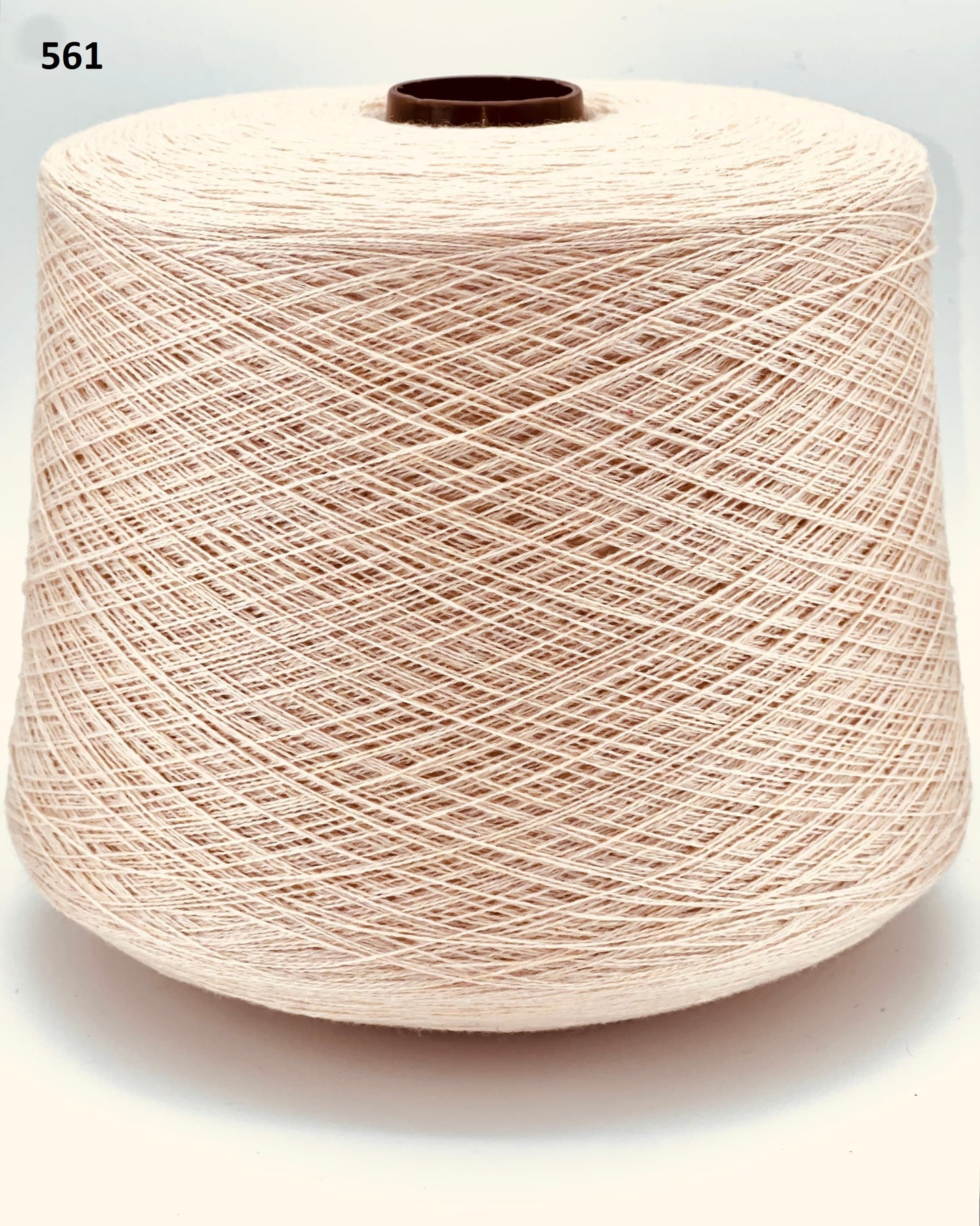 Todd & Duncan 100% Cashmere yarn (2/28 Nm) in a soft neutral palette. Shown as high-quality 2-ply lace weight thread on cones. Made in Scotland. Premium luxury yarn for retail at iDOKNiT.com.