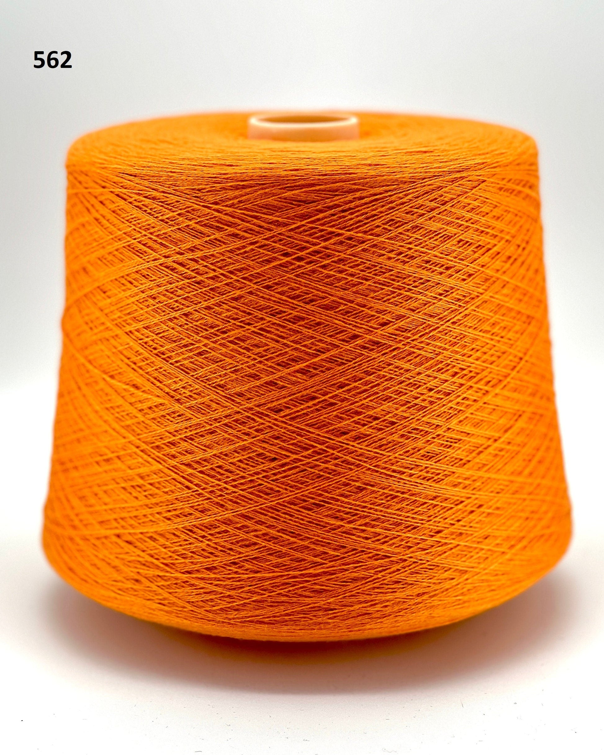 Todd & Duncan 100% Cashmere yarn (2/28 Nm) in a soft neutral palette. Shown as high-quality 2-ply lace weight thread on cones. Made in Scotland. Premium luxury yarn for retail at iDOKNiT.com.