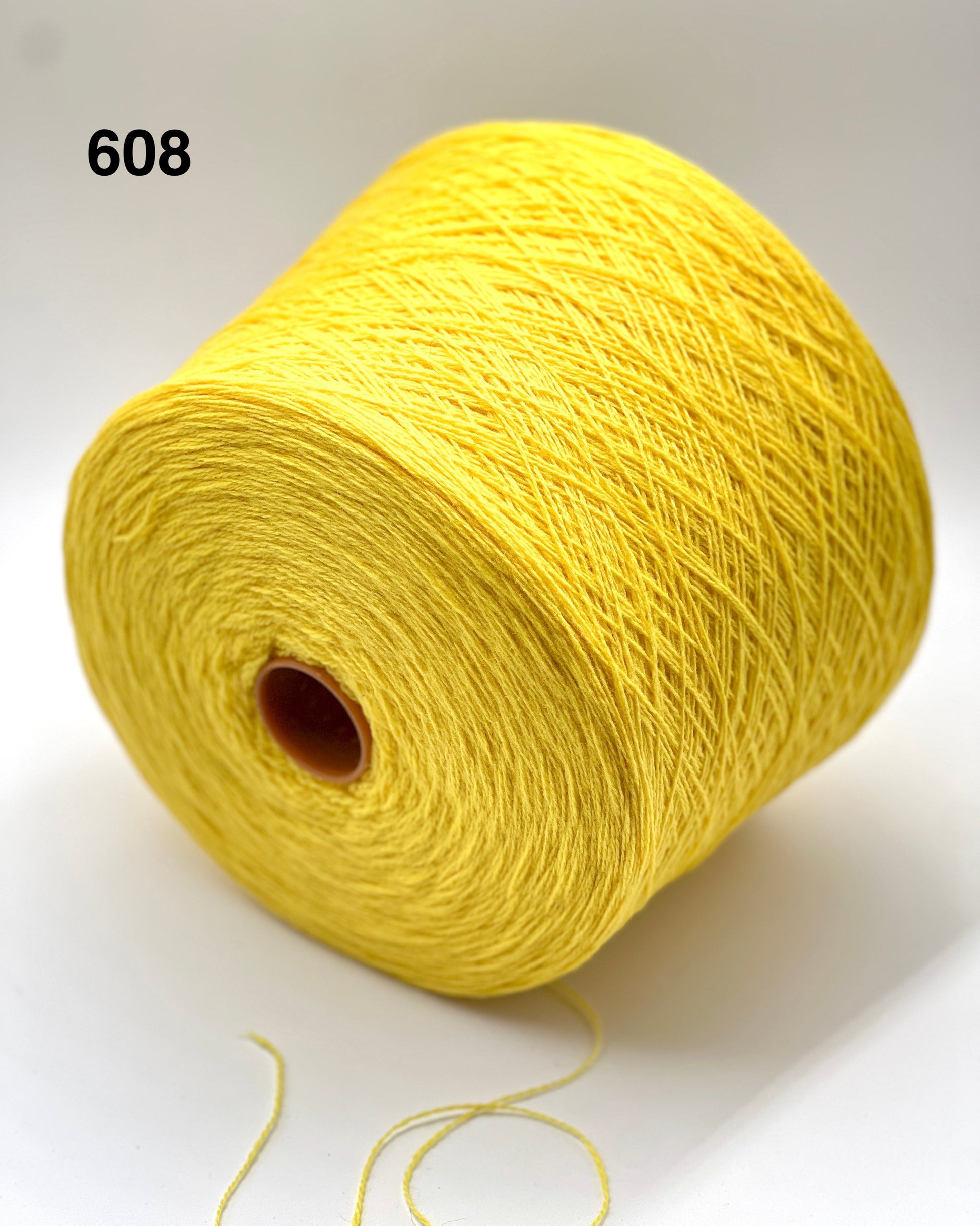 Yellow spool of yarn on a white background with number 608.