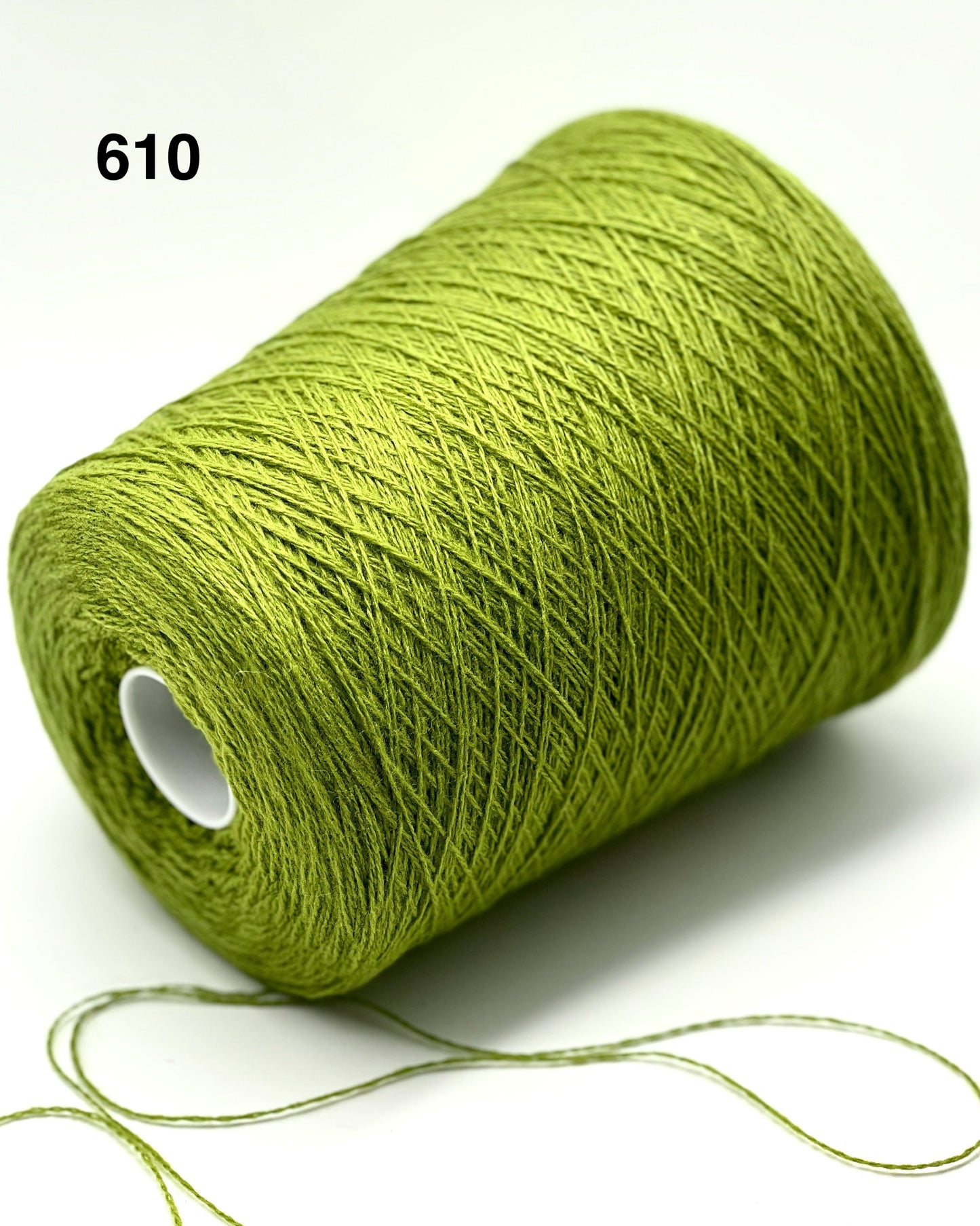 Green spool of yarn on a white background with number 610