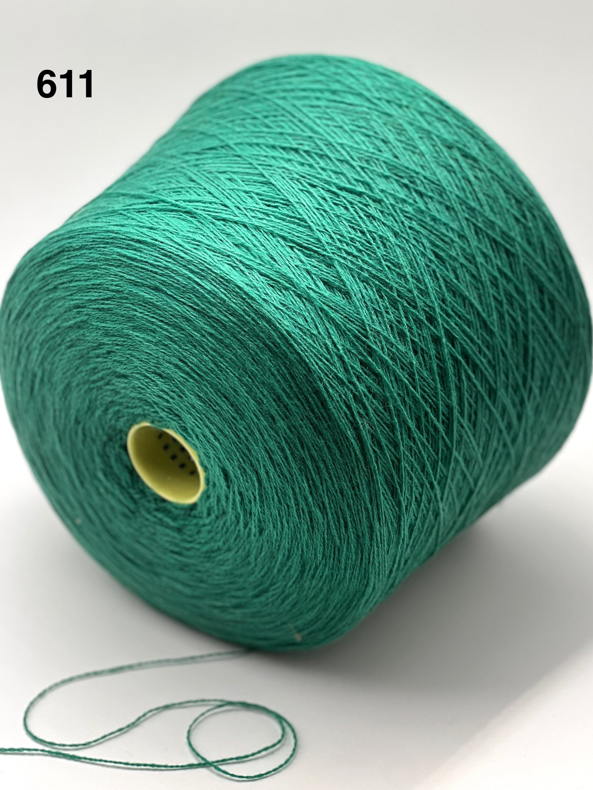 Green spool of yarn on a white background with number 611