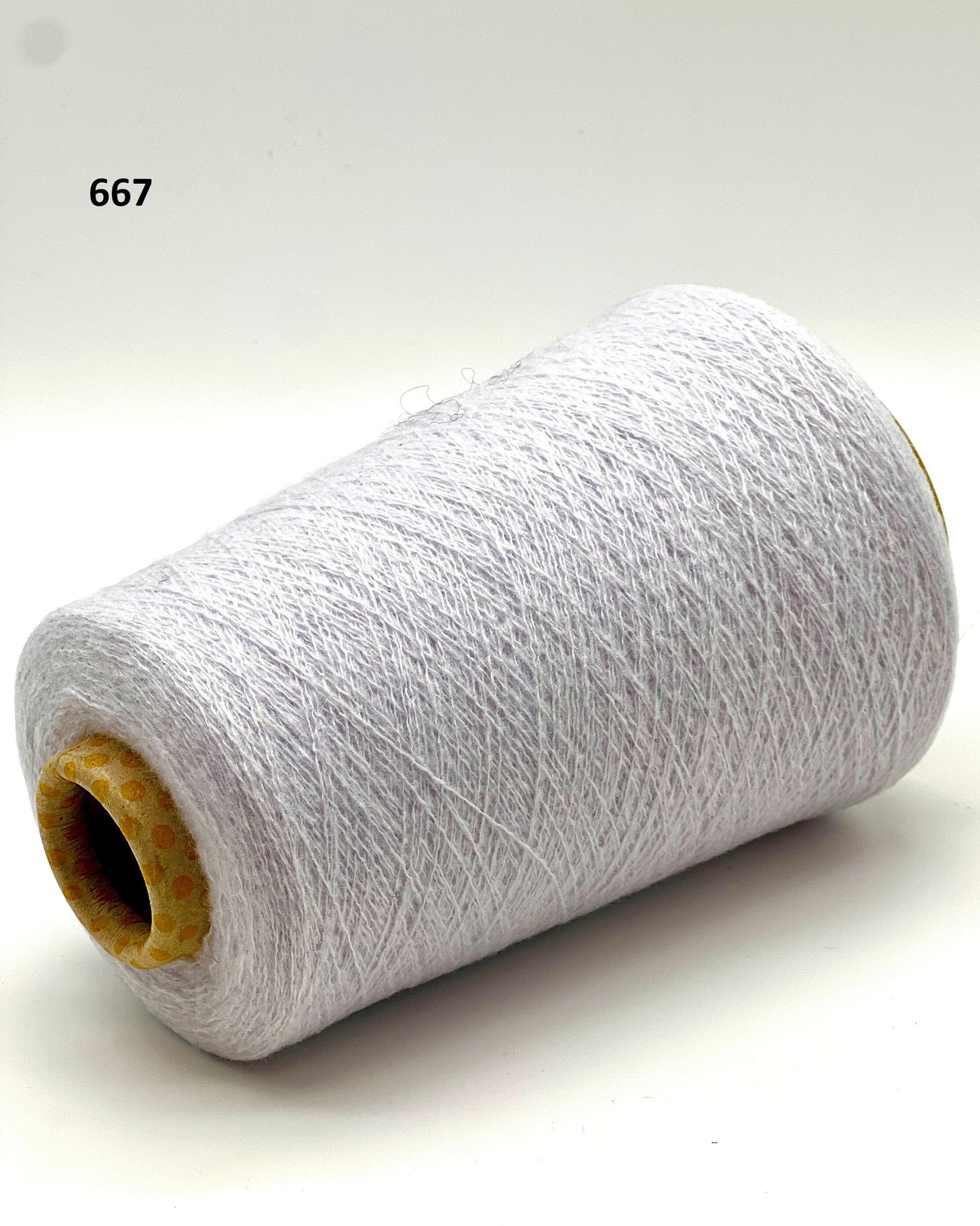 iDOKNiT exclusive: Close-up of Biagioli Modesto VANITY ZERMATT luxury yarn in boucle-style slub texture, a fine Italian cashmere-merino-viscose blend ideal for multi-strand handknitting and machine knitting.