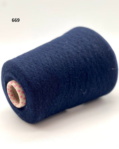 iDOKNiT exclusive: Close-up of Biagioli Modesto VANITY ZERMATT luxury yarn in boucle-style slub texture, a fine Italian cashmere-merino-viscose blend ideal for multi-strand handknitting and machine knitting.