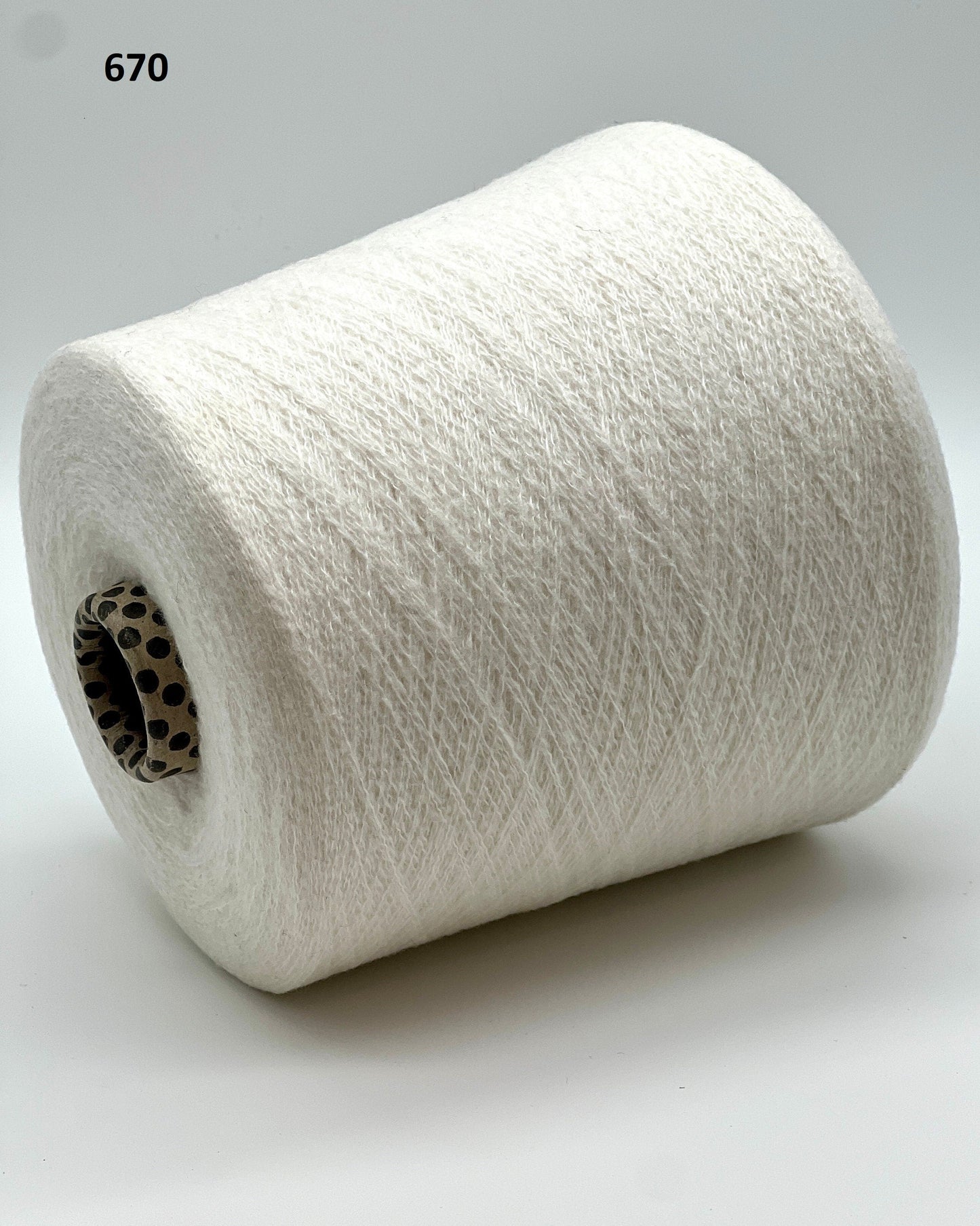 iDOKNiT exclusive: Close-up of Biagioli Modesto VANITY ZERMATT luxury yarn in boucle-style slub texture, a fine Italian cashmere-merino-viscose blend ideal for multi-strand handknitting and machine knitting.