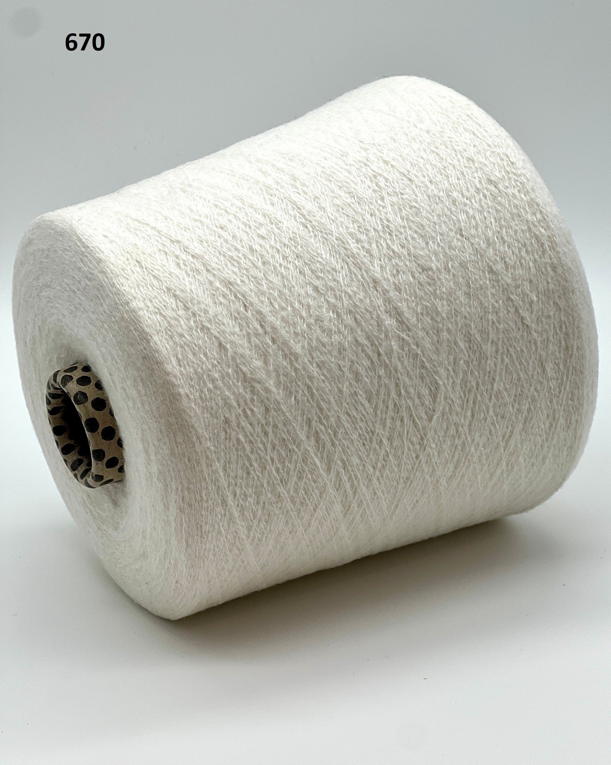 iDOKNiT exclusive: Close-up of Biagioli Modesto VANITY ZERMATT luxury yarn in boucle-style slub texture, a fine Italian cashmere-merino-viscose blend ideal for multi-strand handknitting and machine knitting.