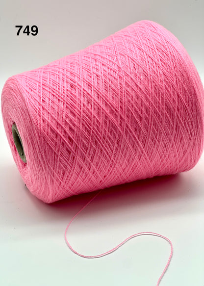 Pink spool of yarn on a white background