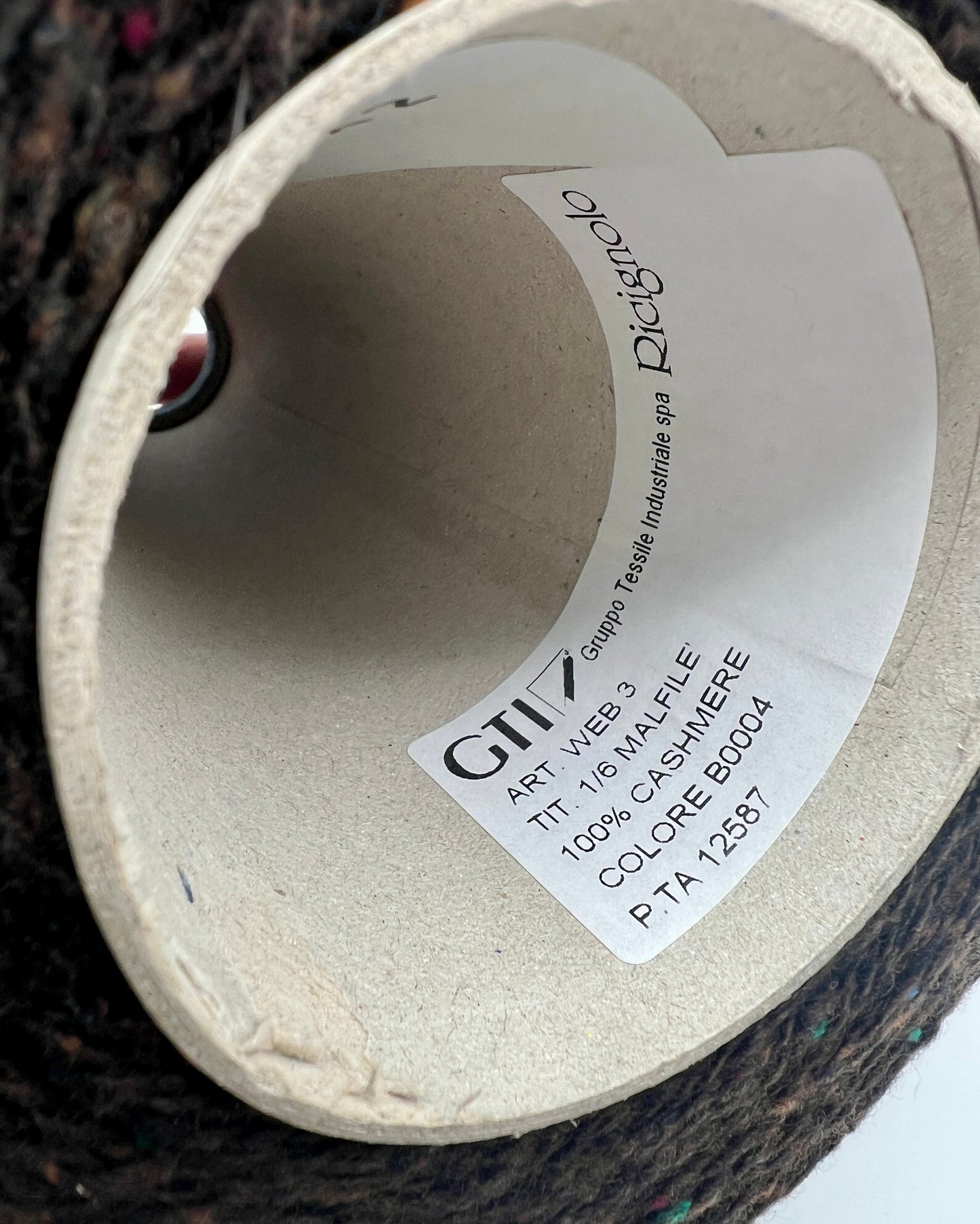 Gruppo Tessile Industriale WEB TWEED Italian cashmere yarn shown on professional cones. This 100% carded cashmere sport weight yarn features a subtle, modern tweed texture and soft loft. Premium luxury designer yarn available at iDOKNiT.com.