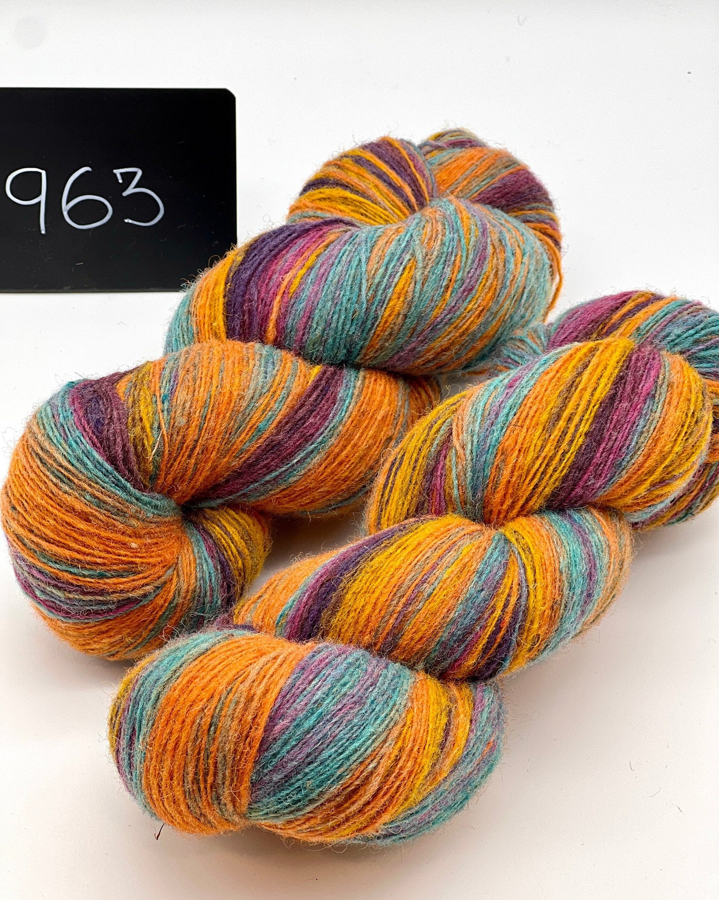 DUNDAGA 6/1 fingering weight single-ply yarn – 70% Latvian wool and 30% Merino blend, high lanolin content for a soft rustic feel, shown in hand-dyed gradients. Ideal for durable socks and heritage knitting with authentic European wool. Available at iDOKNiT.com.