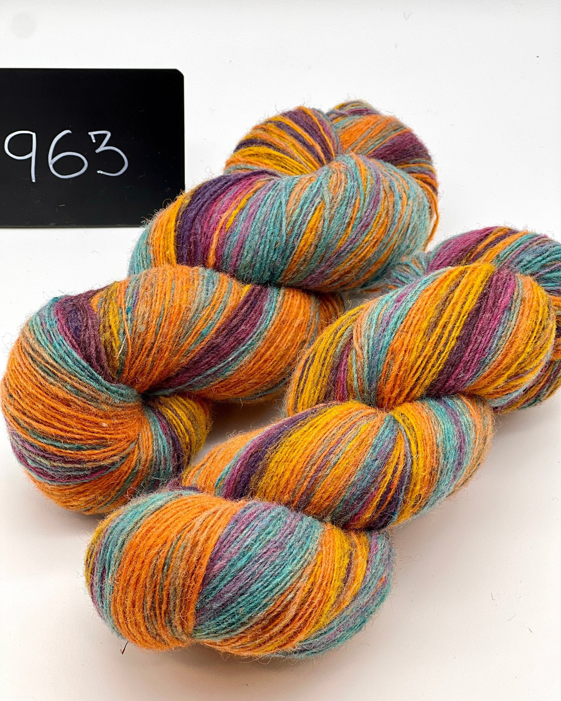 DUNDAGA 6/1 fingering weight single-ply yarn – 70% Latvian wool and 30% Merino blend, high lanolin content for a soft rustic feel, shown in hand-dyed gradients. Ideal for durable socks and heritage knitting with authentic European wool. Available at iDOKNiT.com.