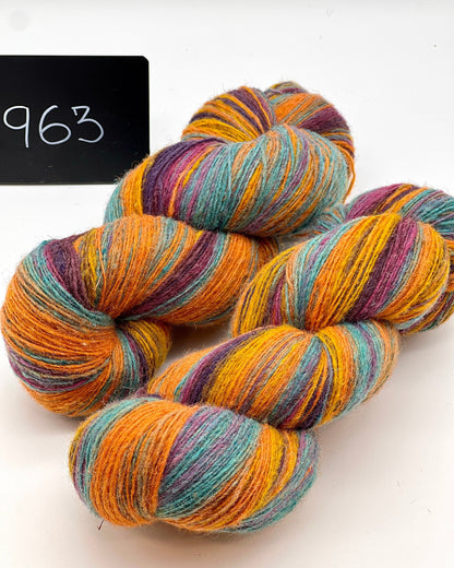 DUNDAGA 6/1 fingering weight single-ply yarn – 70% Latvian wool and 30% Merino blend, high lanolin content for a soft rustic feel, shown in hand-dyed gradients. Ideal for durable socks and heritage knitting with authentic European wool. Available at iDOKNiT.com.