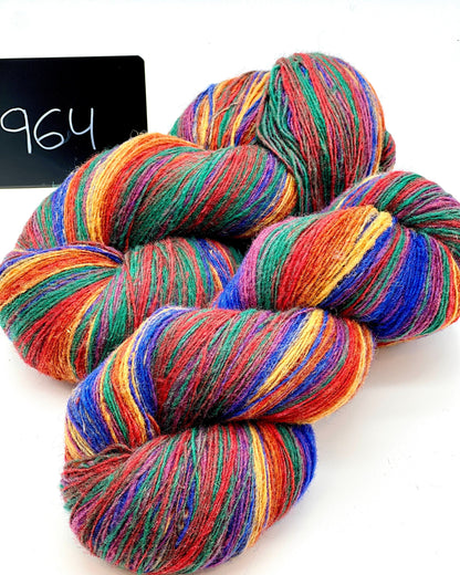 DUNDAGA 6/1 fingering weight single-ply yarn – 70% Latvian wool and 30% Merino blend, high lanolin content for a soft rustic feel, shown in hand-dyed gradients. Ideal for durable socks and heritage knitting with authentic European wool. Available at iDOKNiT.com.