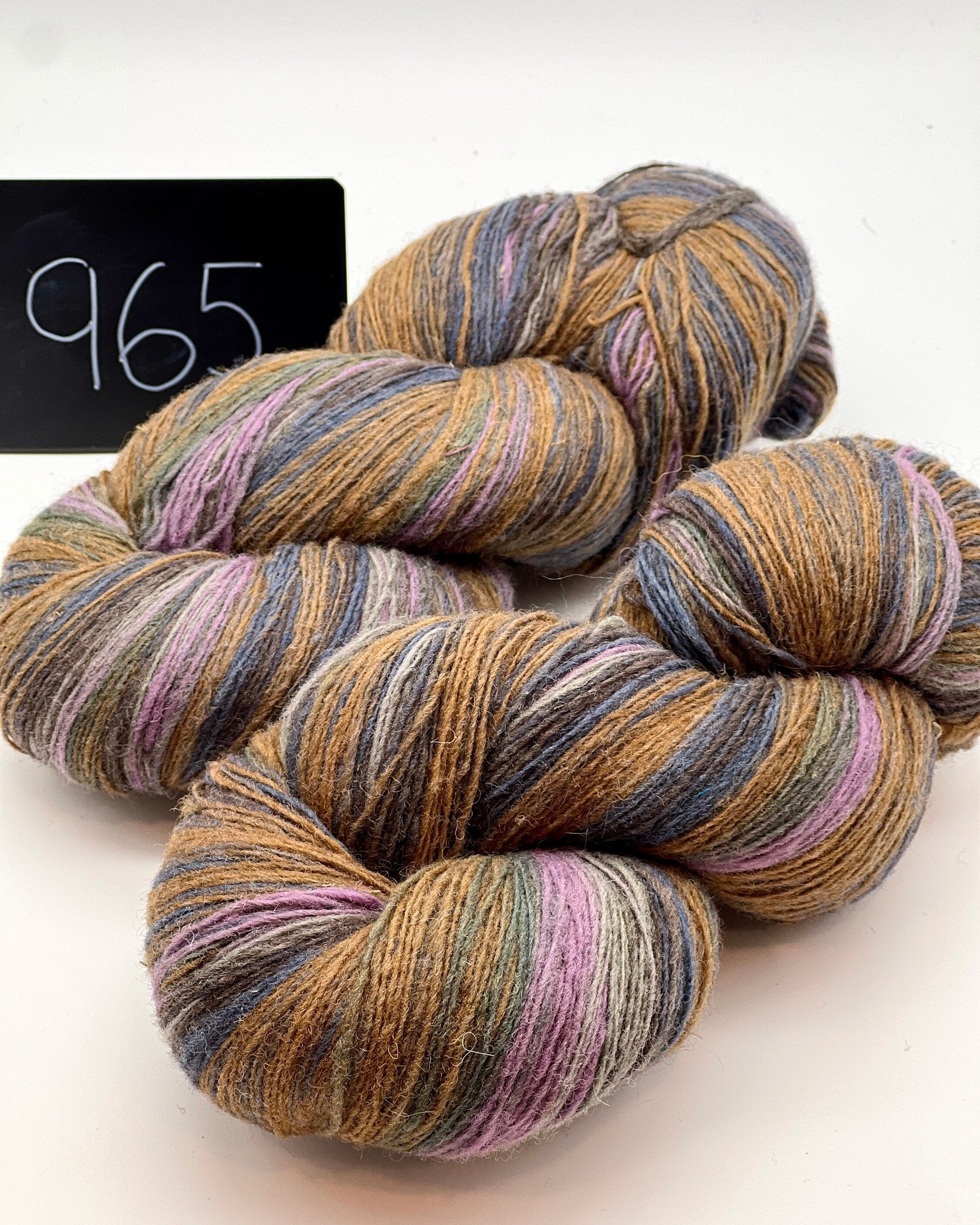 DUNDAGA 6/1 fingering weight single-ply yarn – 70% Latvian wool and 30% Merino blend, high lanolin content for a soft rustic feel, shown in hand-dyed gradients. Ideal for durable socks and heritage knitting with authentic European wool. Available at iDOKNiT.com.