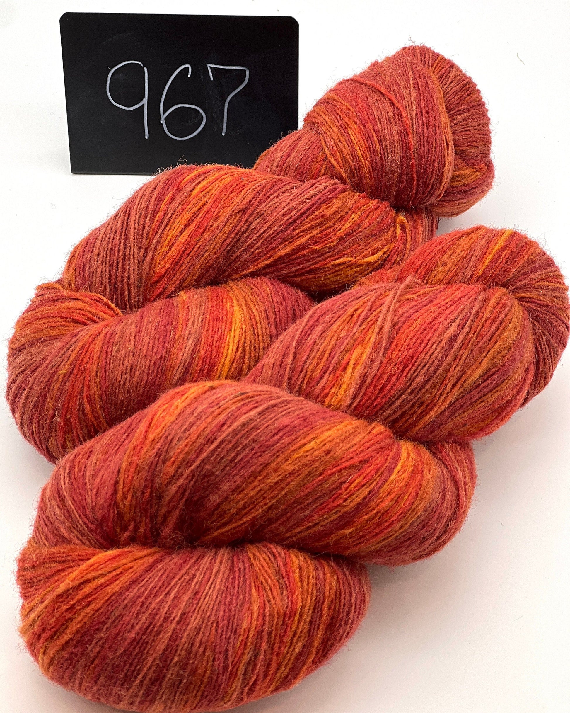 DUNDAGA 6/1 fingering weight single-ply yarn – 70% Latvian wool and 30% Merino blend, high lanolin content for a soft rustic feel, shown in hand-dyed gradients. Ideal for durable socks and heritage knitting with authentic European wool. Available at iDOKNiT.com.