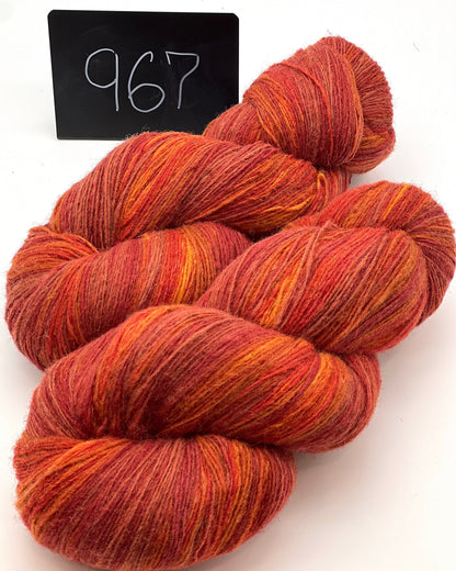 DUNDAGA 6/1 fingering weight single-ply yarn – 70% Latvian wool and 30% Merino blend, high lanolin content for a soft rustic feel, shown in hand-dyed gradients. Ideal for durable socks and heritage knitting with authentic European wool. Available at iDOKNiT.com.