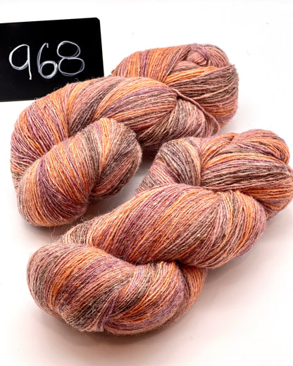 DUNDAGA 6/1 fingering weight single-ply yarn – 70% Latvian wool and 30% Merino blend, high lanolin content for a soft rustic feel, shown in hand-dyed gradients. Ideal for durable socks and heritage knitting with authentic European wool. Available at iDOKNiT.com.