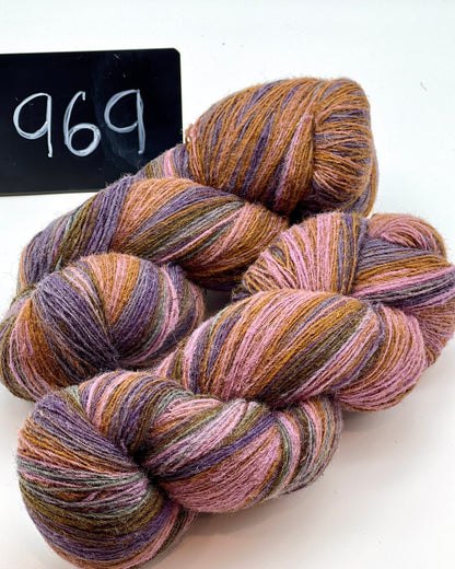 DUNDAGA 6/1 fingering weight single-ply yarn – 70% Latvian wool and 30% Merino blend, high lanolin content for a soft rustic feel, shown in hand-dyed gradients. Ideal for durable socks and heritage knitting with authentic European wool. Available at iDOKNiT.com.