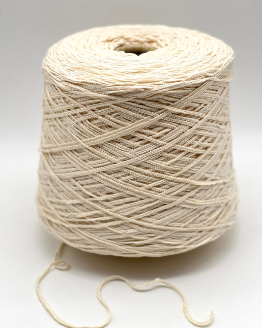 Filati Biagioli Modesto SUGHERO chunky i-cord yarn in 1932 IVORY. This luxury Italian blend of cashmere, silk, and cotton features a soft, rounded chainette structure on a professional cone. High-end designer yarn available at iDOKNiT.com.