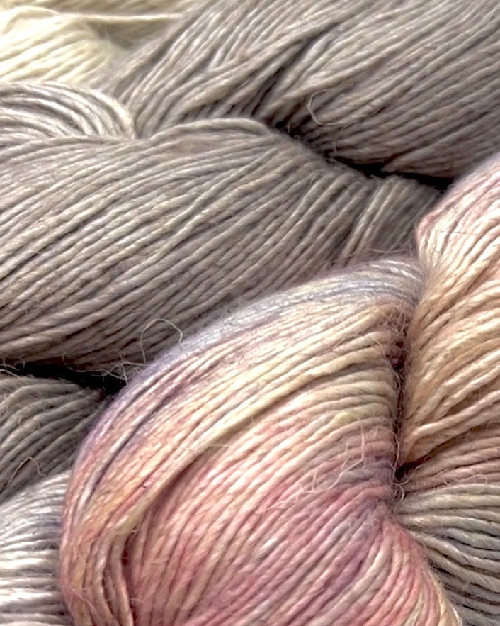 Premium iDOKNiT DK Sport weight yarn, SUSURRO by Malabrigo Peru. Luxury blend of 50% mulberry silk, 25% merino wool, and 25% linen, 297m/100g. Hand-dyed authentic Peruvian yarn curated by iDOKNiT for lightweight garments with elegant drape and sophisticated linen texture.