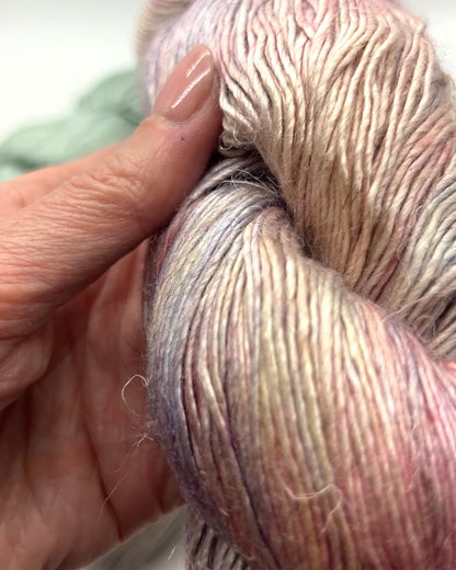 Premium iDOKNiT DK Sport weight yarn, SUSURRO by Malabrigo Peru. Luxury blend of 50% mulberry silk, 25% merino wool, and 25% linen, 297m/100g. Hand-dyed authentic Peruvian yarn curated by iDOKNiT for lightweight garments with elegant drape and sophisticated linen texture.
