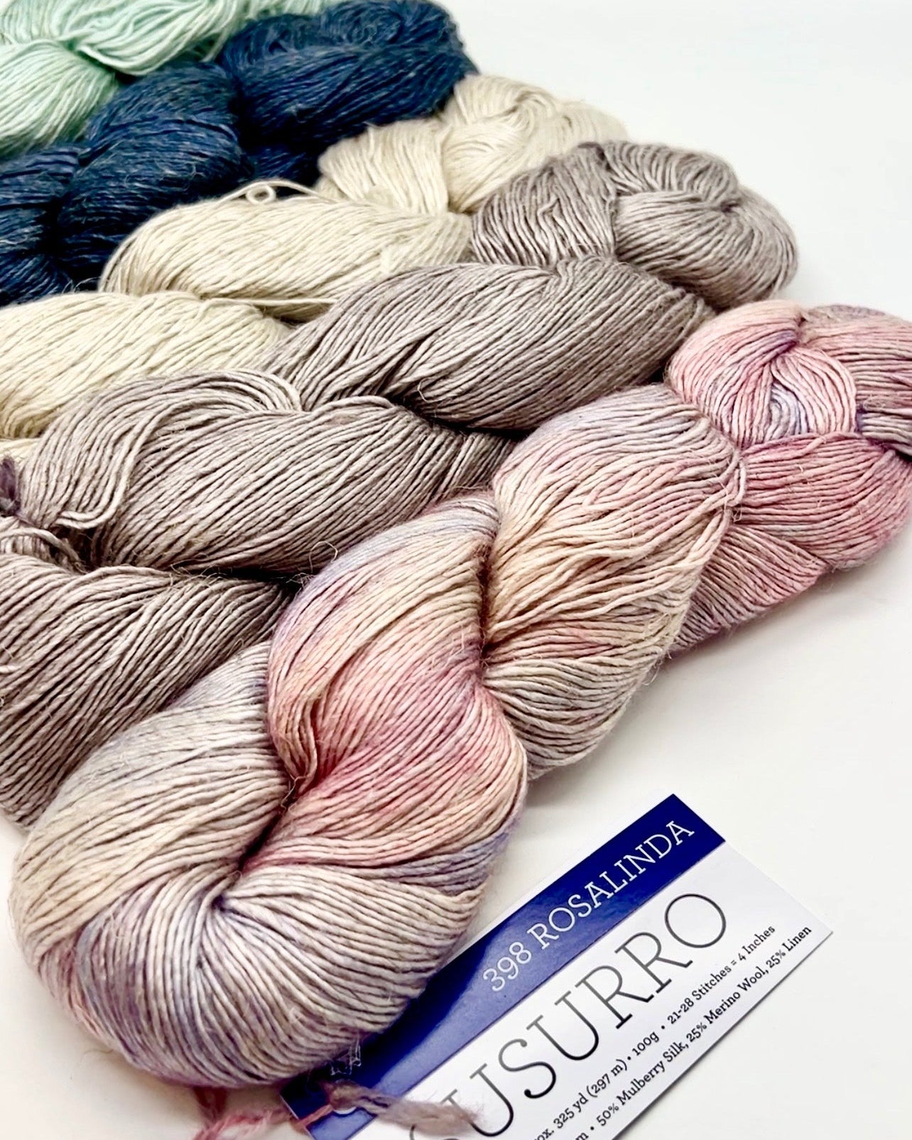 Premium iDOKNiT DK Sport weight yarn, SUSURRO by Malabrigo Peru. Luxury blend of 50% mulberry silk, 25% merino wool, and 25% linen, 297m/100g. Hand-dyed authentic Peruvian yarn curated by iDOKNiT for lightweight garments with elegant drape and sophisticated linen texture.