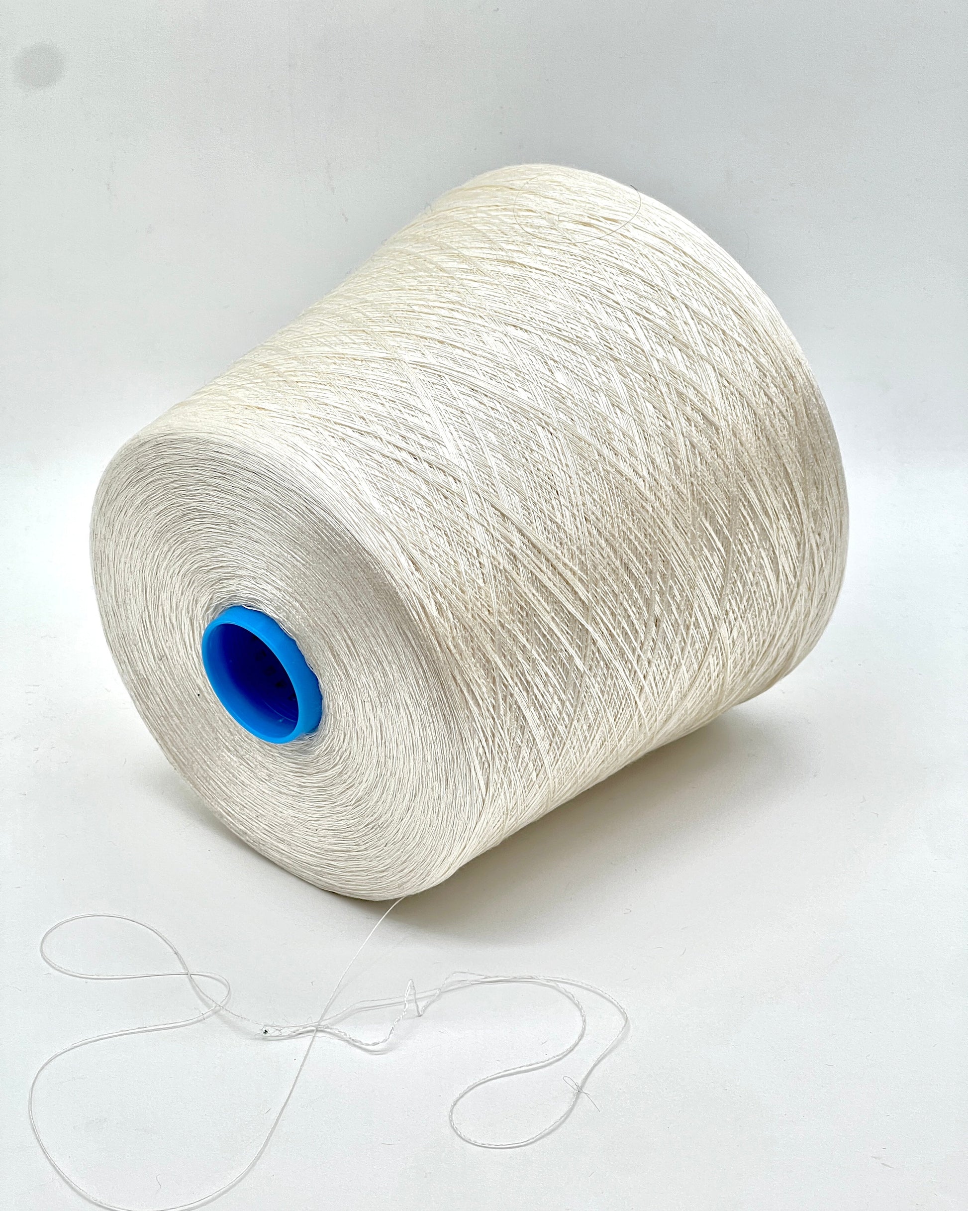 Exclusive iDOKNiT extra fine lace weight yarn, SETA SHAPPE by RiGo Italy. 100% pure Silk Shappe industrial-grade yarn, Nm 2/60, providing 2600m per 100g. Authentic Italian-made silk on cones curated by iDOKNiT for delicate lace, weaving, and professional machine knitting projects.