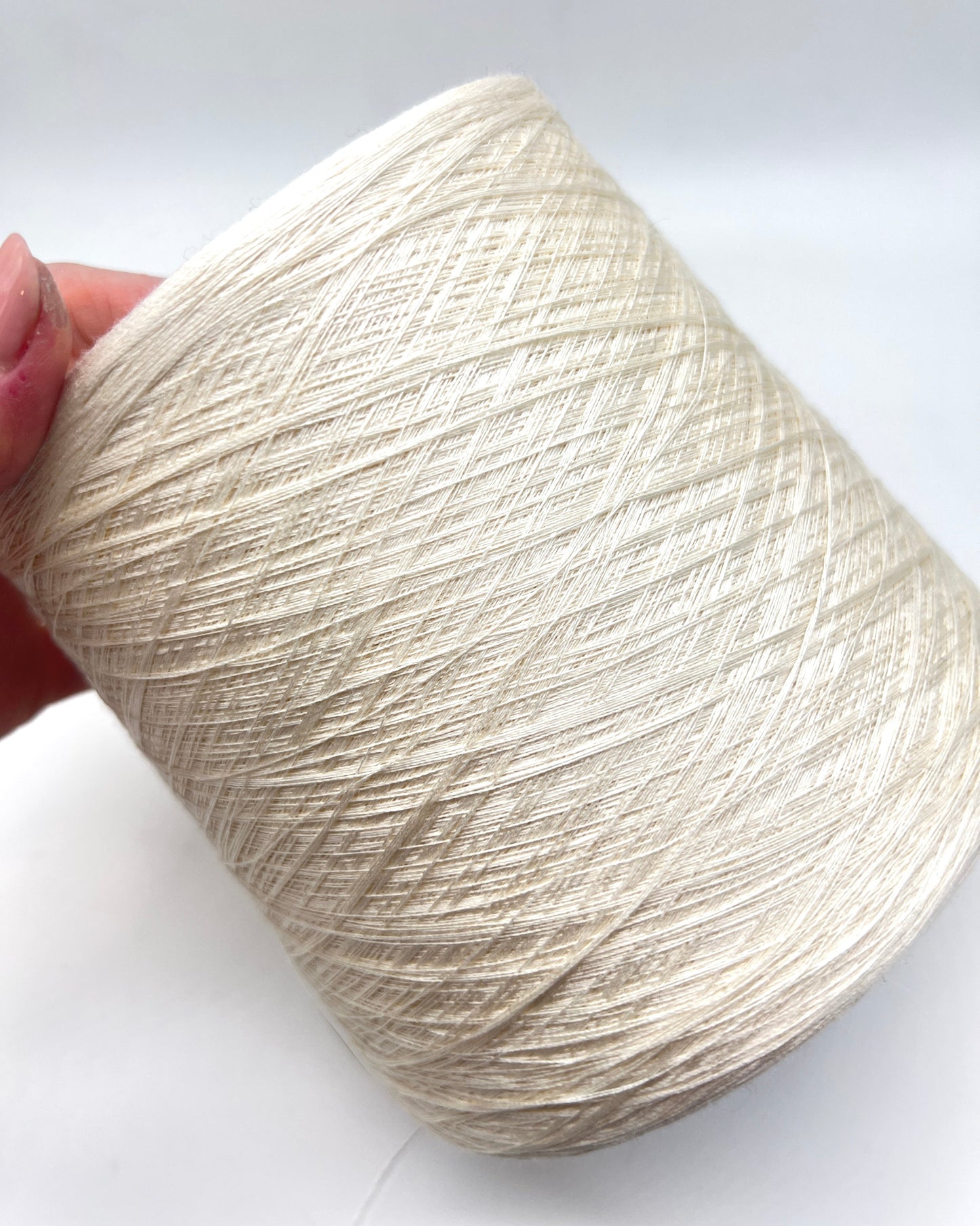 Exclusive iDOKNiT extra fine lace weight yarn, SETA SHAPPE by RiGo Italy. 100% pure Silk Shappe industrial-grade yarn, Nm 2/60, providing 2600m per 100g. Authentic Italian-made silk on cones curated by iDOKNiT for delicate lace, weaving, and professional machine knitting projects.